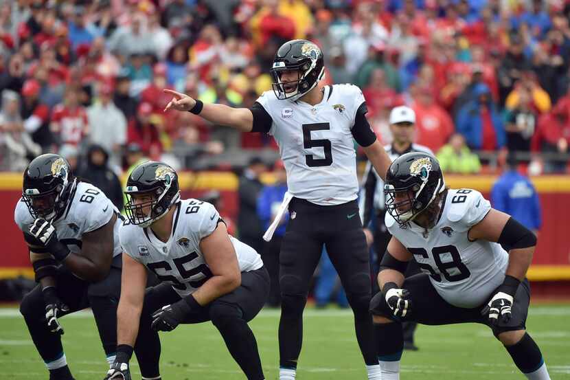 Jacksonville Jaguars quarterback Blake Bortles (5) points at the line of scrimmage during...