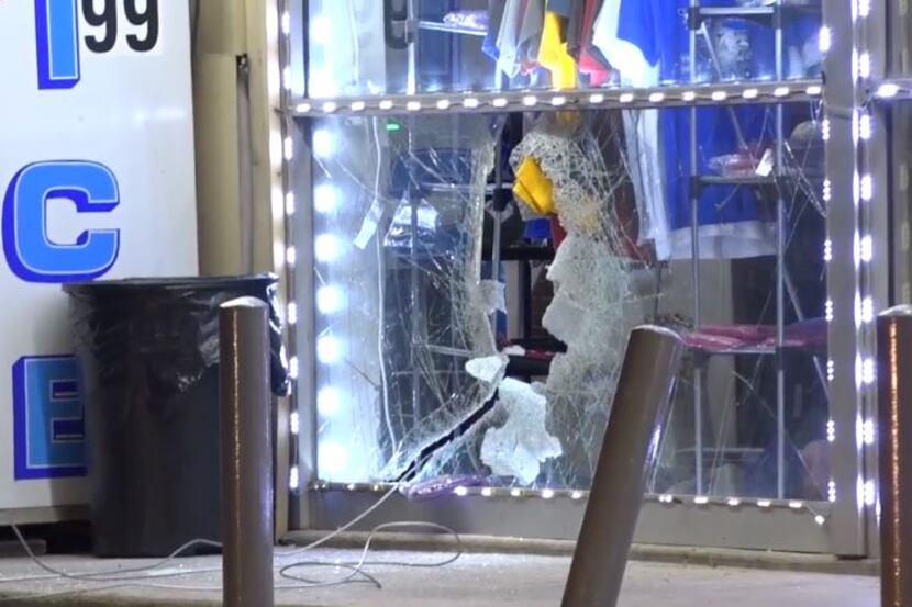 Some ATM thieves left behind a smashed window at a convenience store in Old East Dallas on...