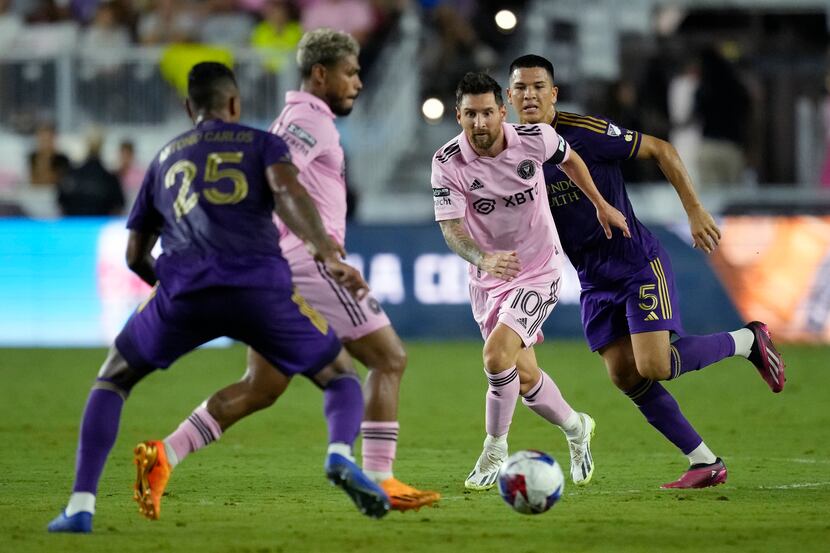 Inter Miami forward Lionel Messi (10) watches as forward Josef Martínez controls the ball,...
