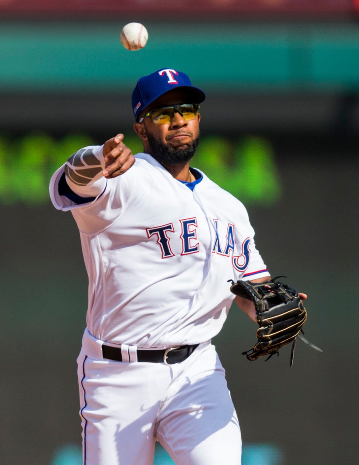 Texas Rangers shortstop Elvis Andrus (1) throws to first base to out Chicago Cubs third...