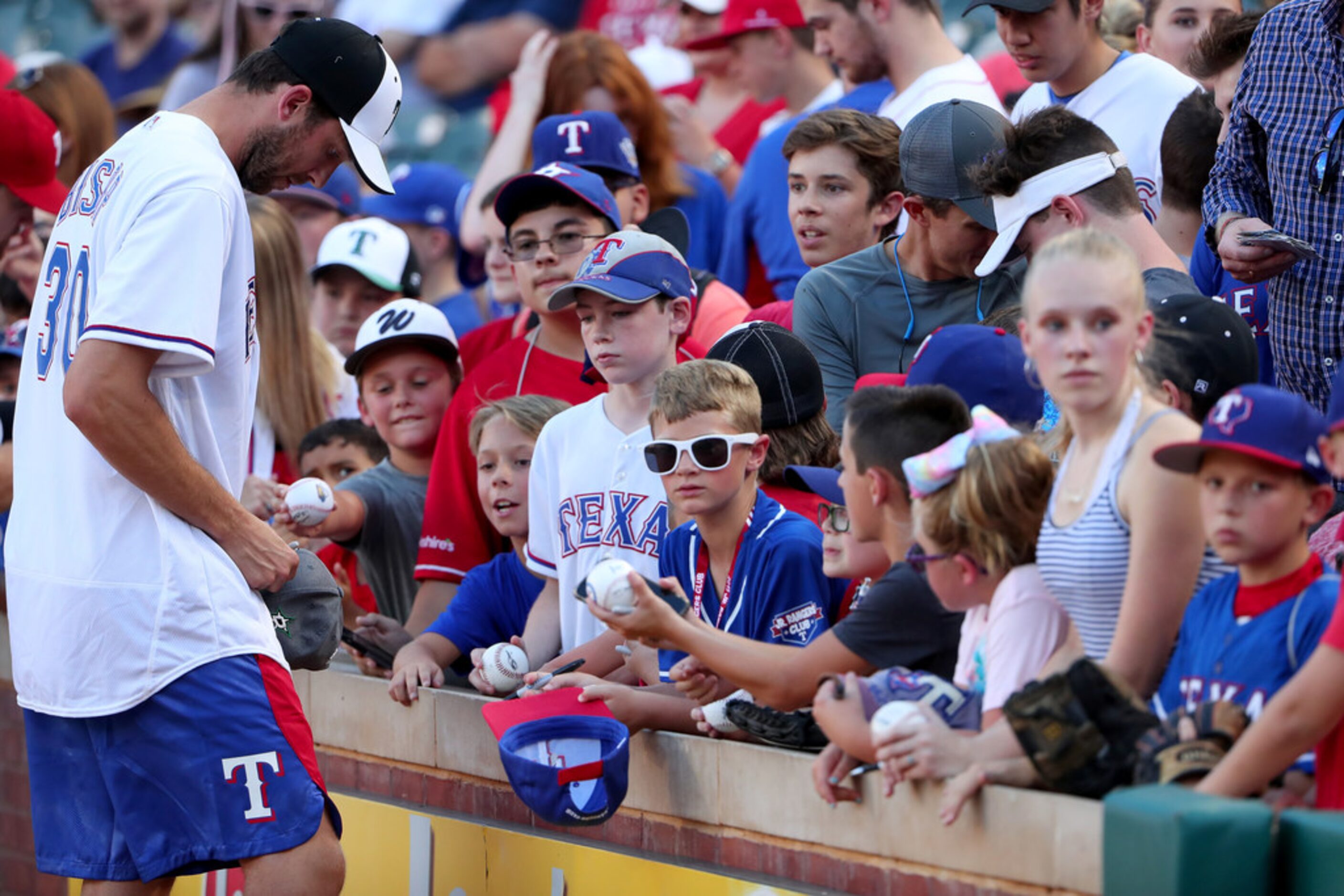 ARLINGTON, TEXAS - JULY 17: Ben Bishop of the Dallas Stars sign autographs for fans before...