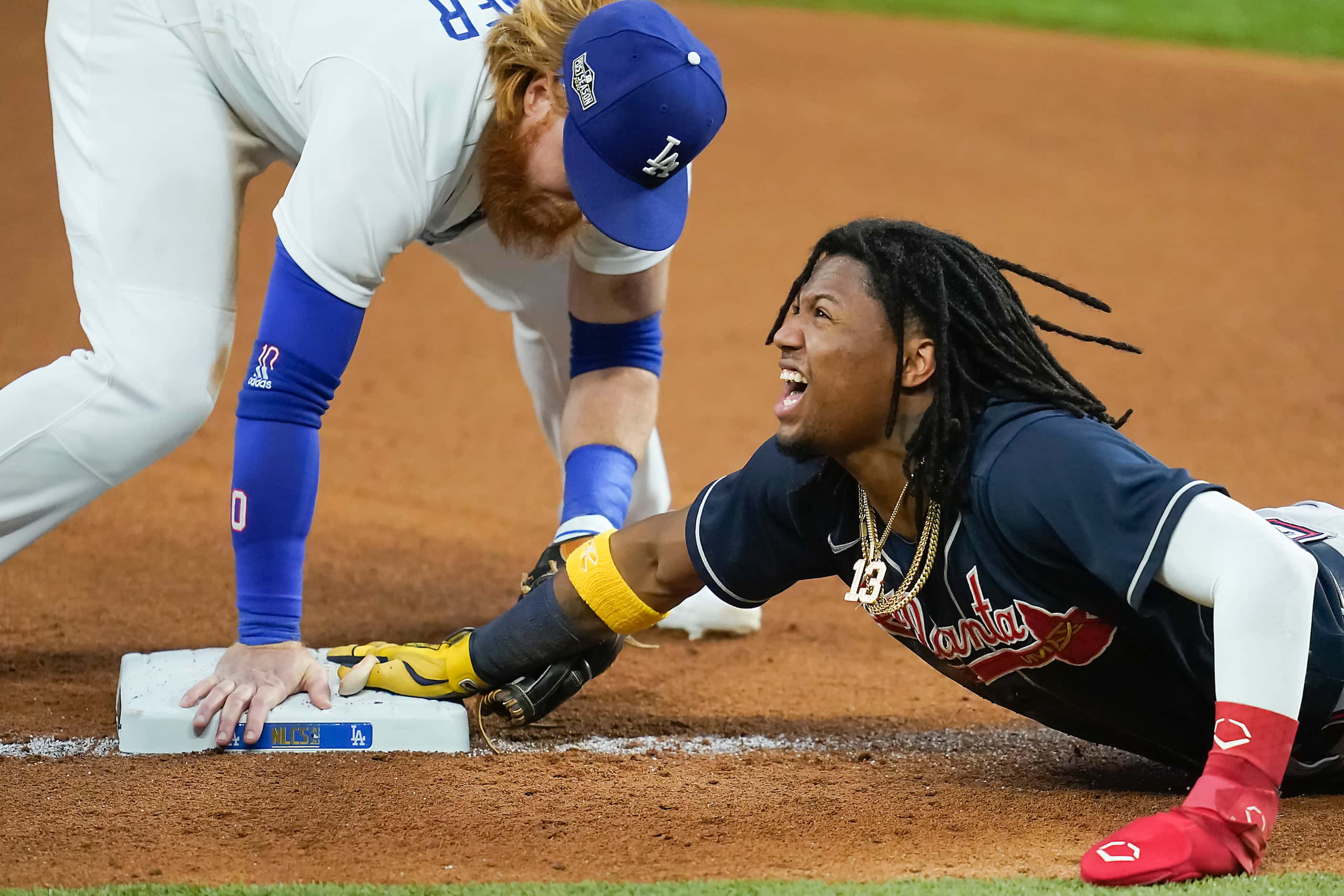 Atlanta Braves right fielder Ronald Acuna Jr. is safe at third base advancing from first to...