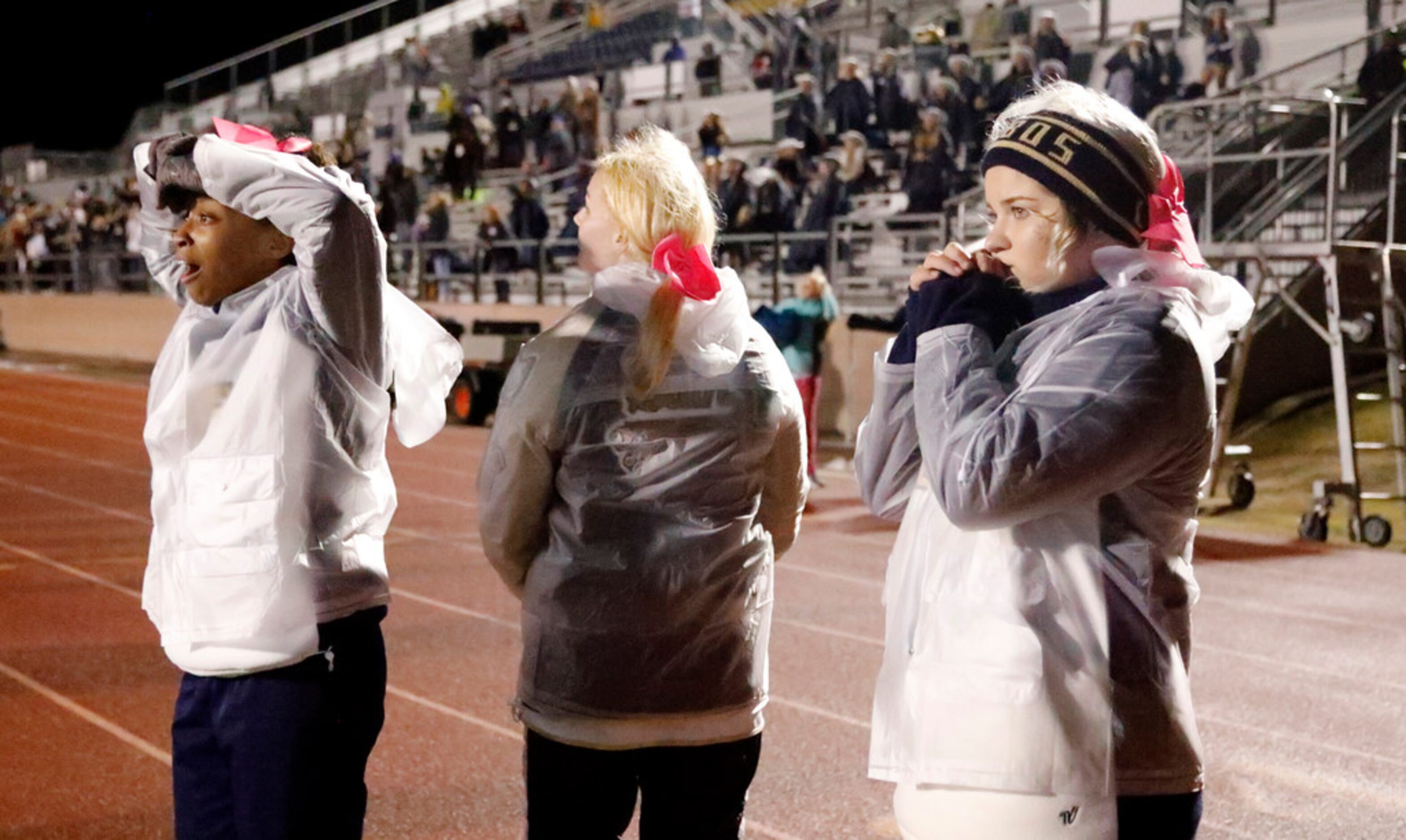 Little Elm cheerleaders (left to right) Karmen Brown, Lauren Guin, and Serenity Thompson...