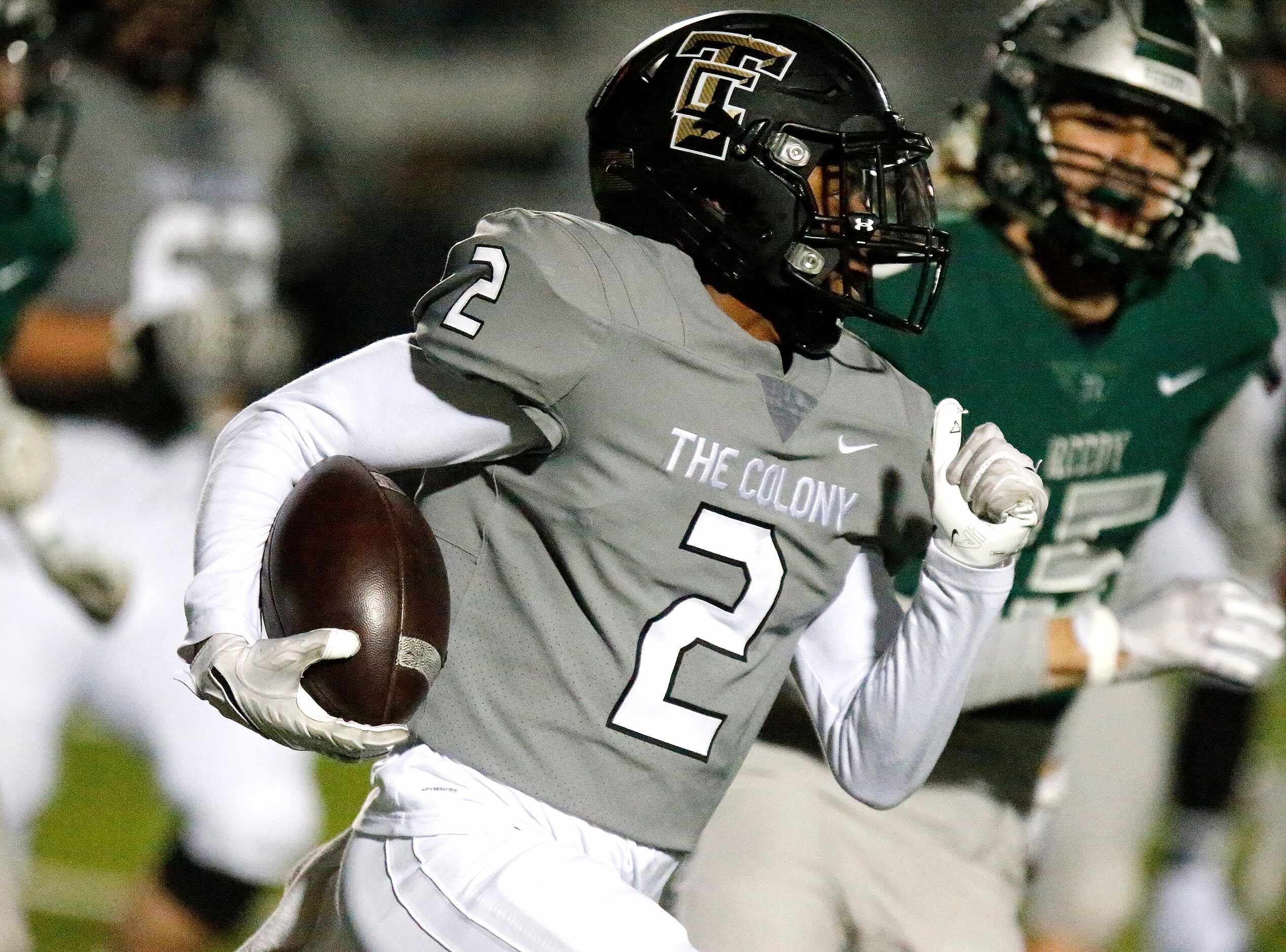 The Colony High School running back Shafiq Taylor (2) carries the football uring the first...