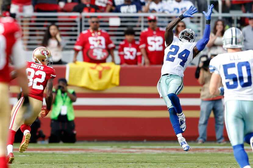 Dallas Cowboys cornerback Morris Claiborne (24) intercepts a pass in front of San Francisco...