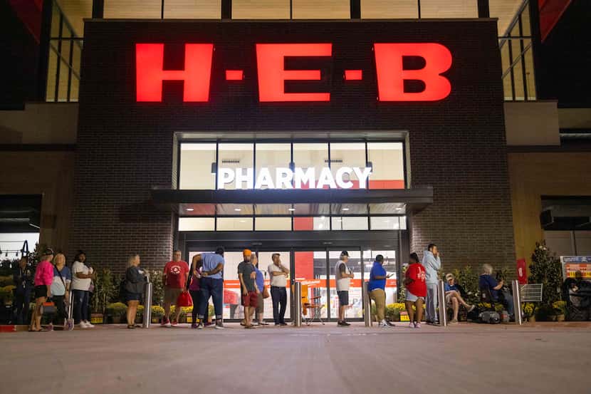 People waited in line before the grand opening of the H-E-B store in Allen on Oct. 4. The...