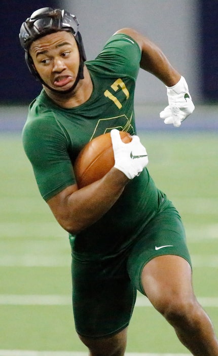 Jaxon Smith-Njigba (17) of Rockwall High School, runs after the catch during The Opening...