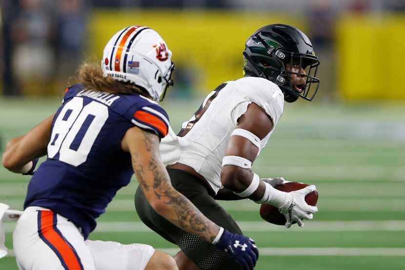 FILE - Oregon safety Jevon Holland (8) intercepts a pass intended for Auburn wide receiver...