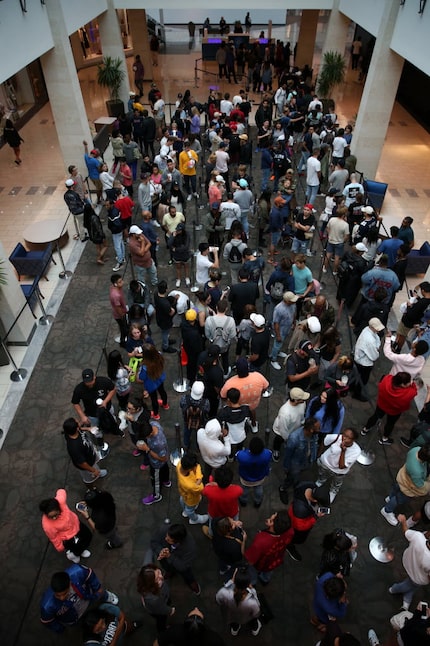 Shoppers wait in line outside Kanye West's 'Pablo' pop-up shop at Stonebriar Centre in...