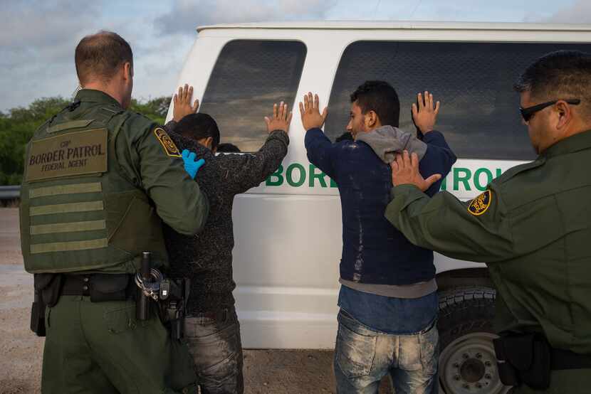 Border Patrol agents apprehend immigrants shortly after they crossed the border from Mexico...