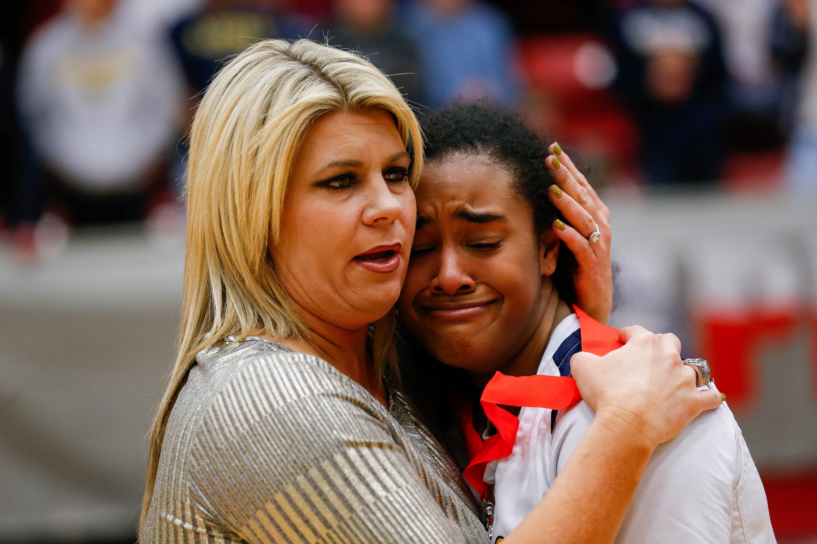 Plano Prestonwood Christian's Bria Stephens (24) hugs coach Holly Mulligan after losing a...