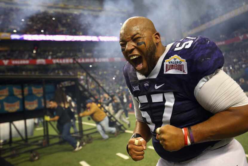 SAN ANTONIO, TX - JANUARY 02:  Davion Pierson #57 of the TCU Horned Frogs celebrates after...