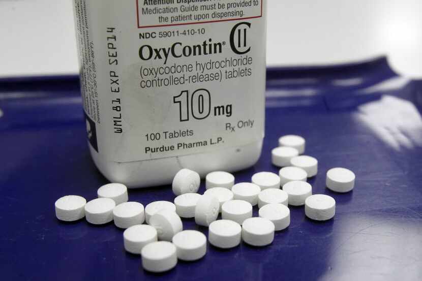 OxyContin pills are arranged for a photo at a pharmacy in Montpelier, Vt. on Tuesday, Feb....