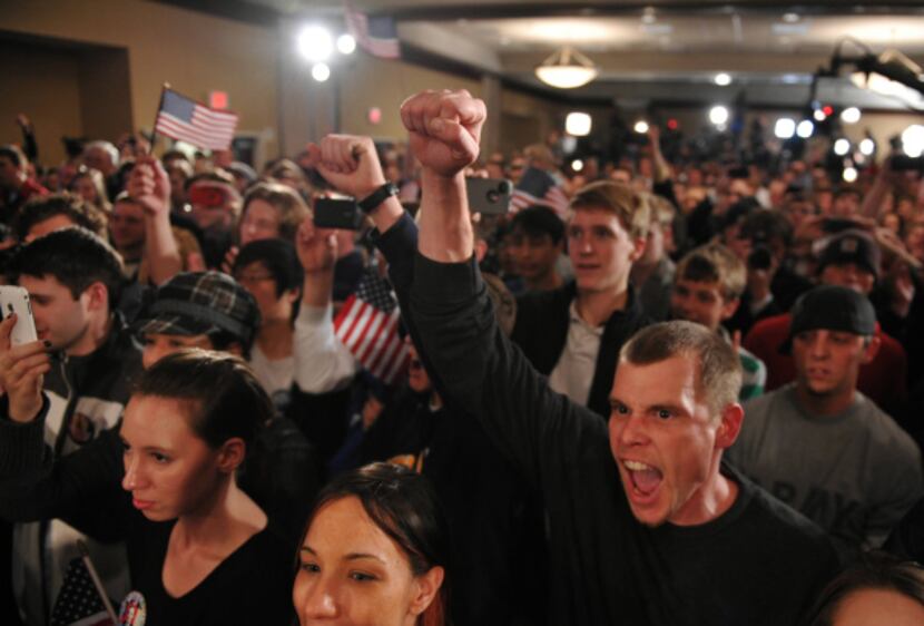 Brandon Smith (right) of St. Louis was part of an energetic crowd last week in Iowa hearing...