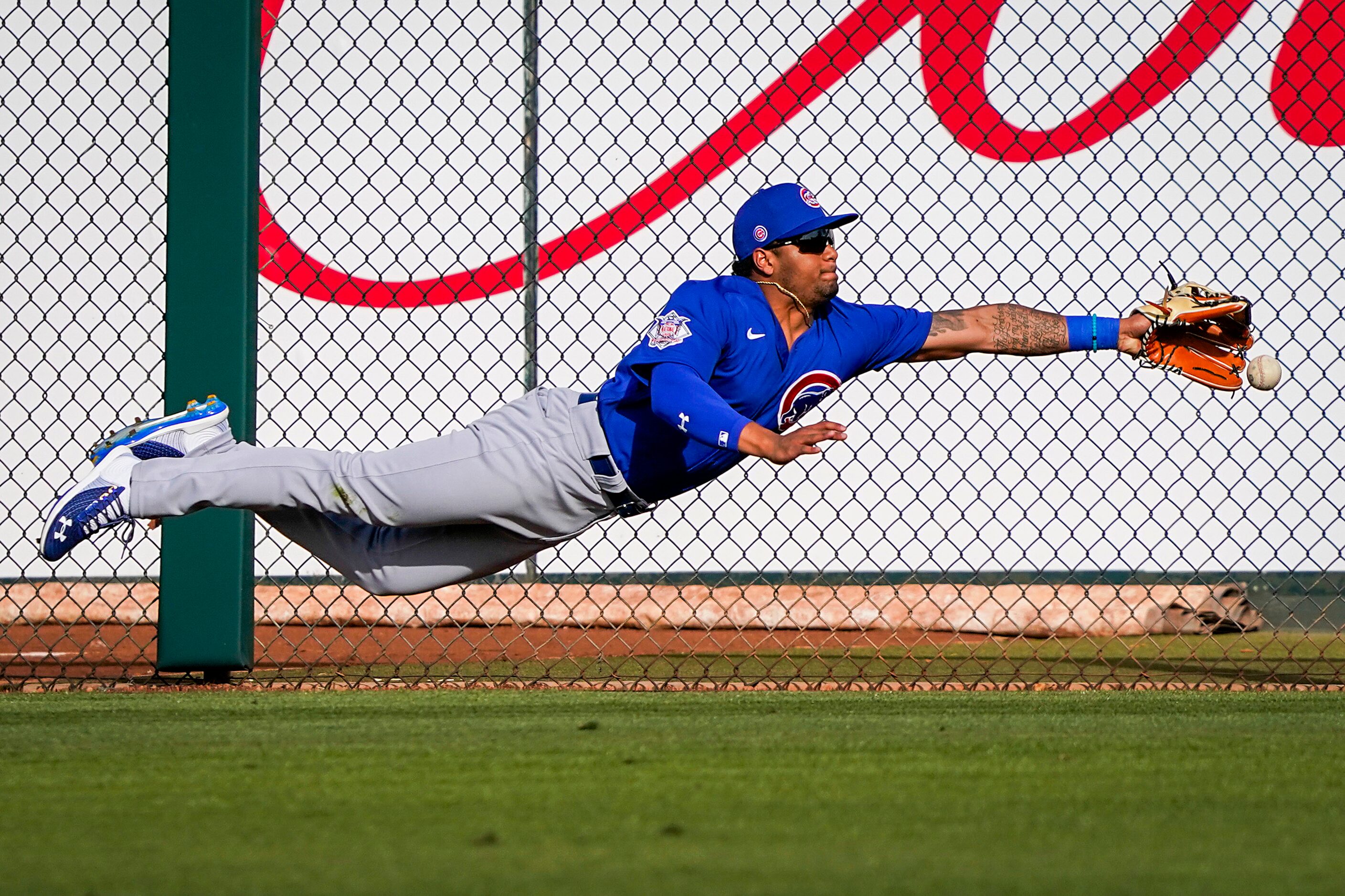 Chicago Cubs right fielder Chancer Burks canÕt make a diving play on a triple off of the bat...