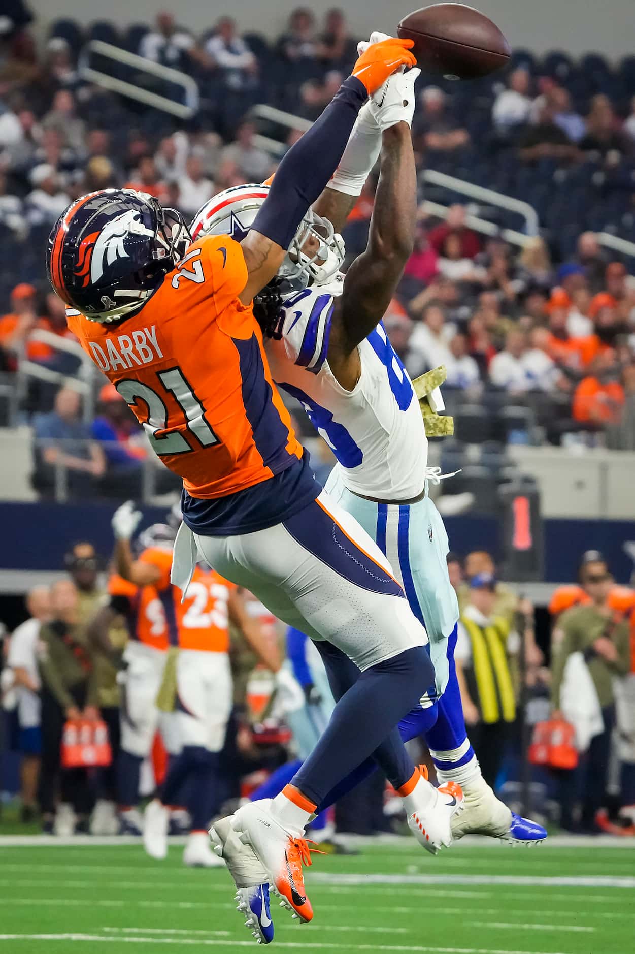 Denver Broncos cornerback Ronald Darby (21) breaks up a pass intended for Dallas Cowboys...