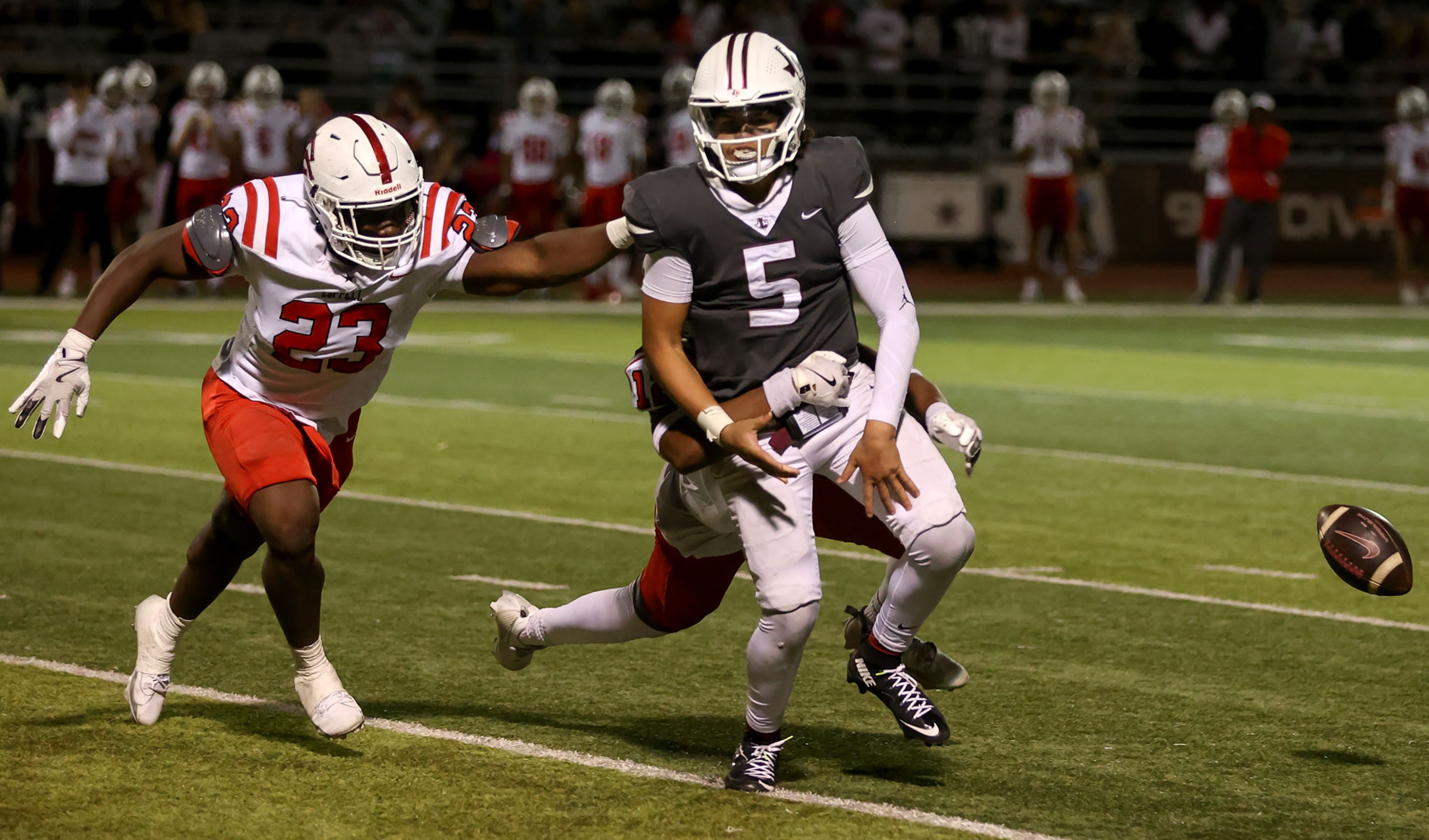 Lewisville quarterback Tre Williams (5) gets stripped and fumbles the ball from Coppell...