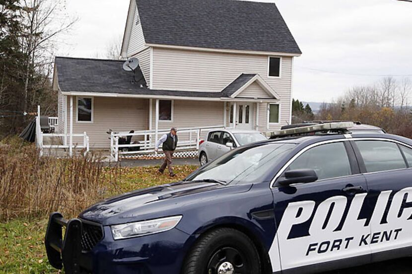 Fort Kent Police Chief Thomas Pelletier leaves the home of nurse Kaci Hickox after a brief...