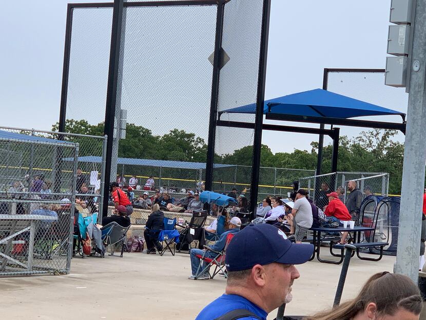 Fans watch the Top Gun Heritage club softball tournament in Choctaw, Okla., in mid-May.