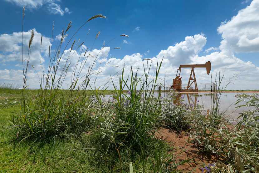 A pump jack draws oil north of Lubbock, Texas, Wednesday, August 2, 2017. 