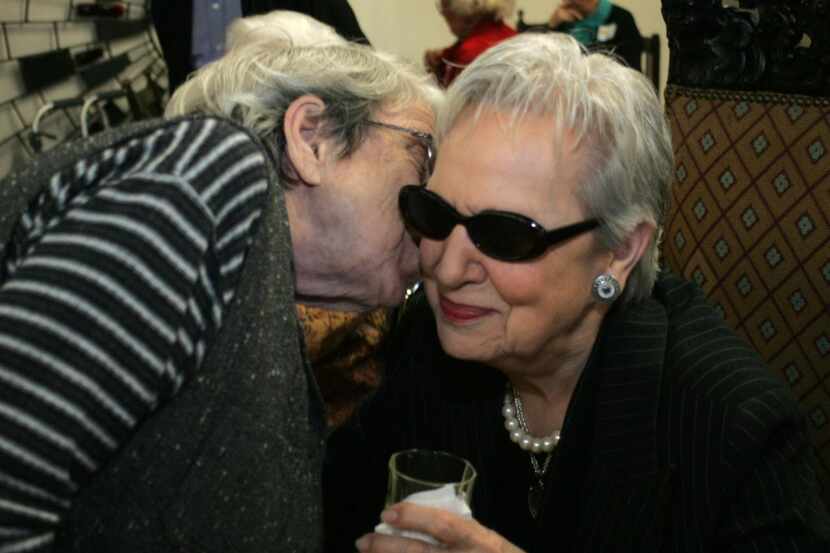 
Louise Cowan, right, gets a kiss from Nellie Kendall, during Louise's 90th birthday...
