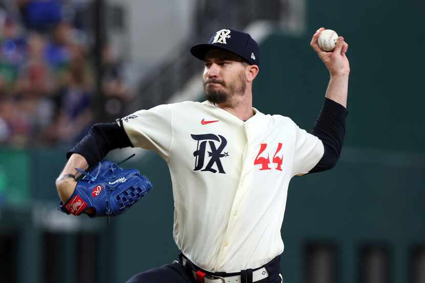 Texas Rangers starting pitcher Andrew Heaney delivers in the first inning against the...