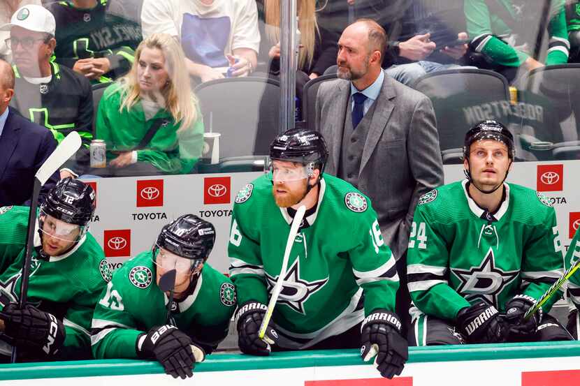 Dallas Stars head coach Pete DeBoer watches from the bench during the third period of an NHL...