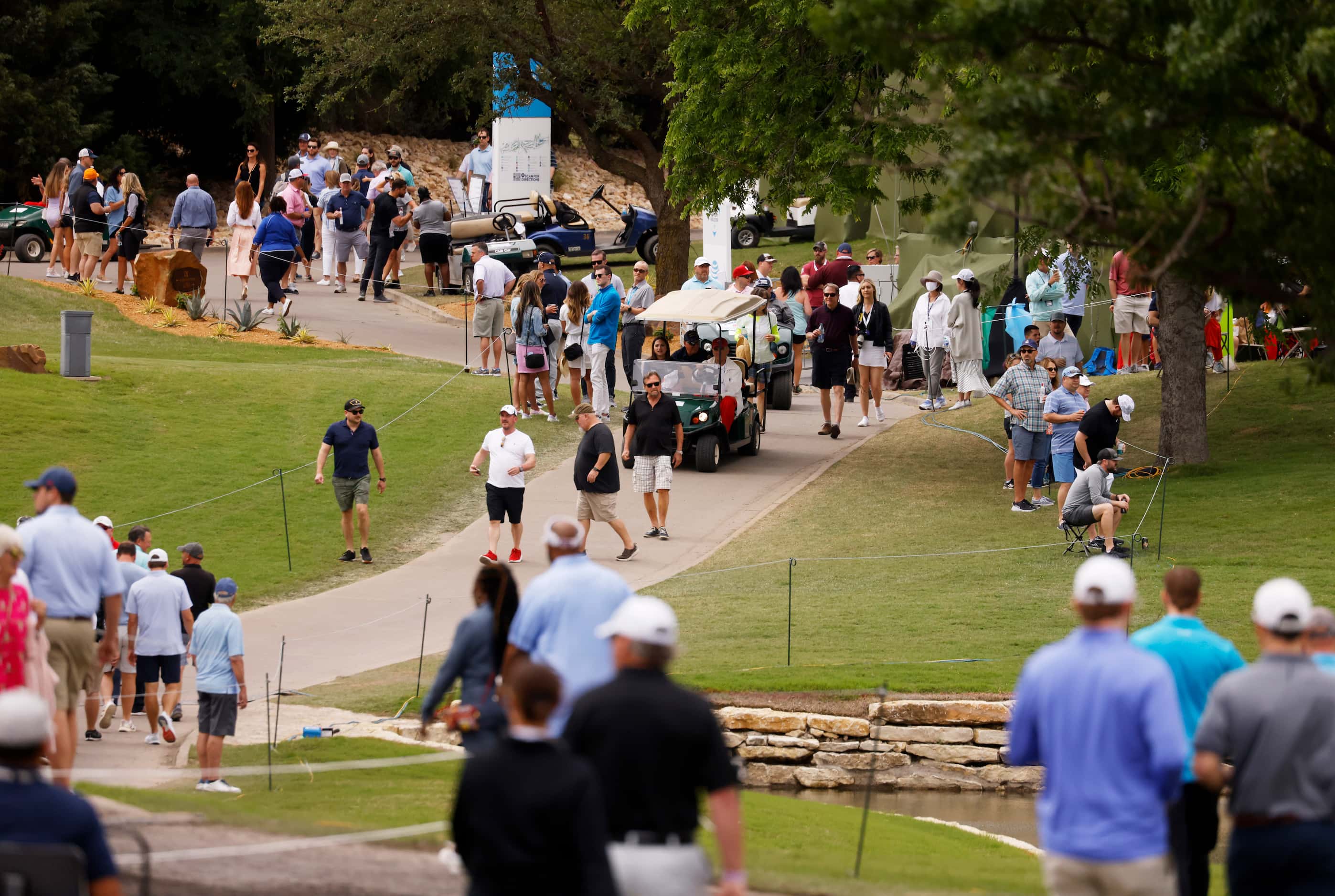 Fans make their way around the course near the 18th hole during round 2 of the AT&T Byron...