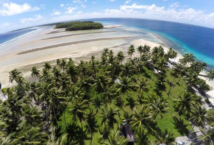 This Nov. 6, 2015, photo shows a large section of land between the trees washed away due to...