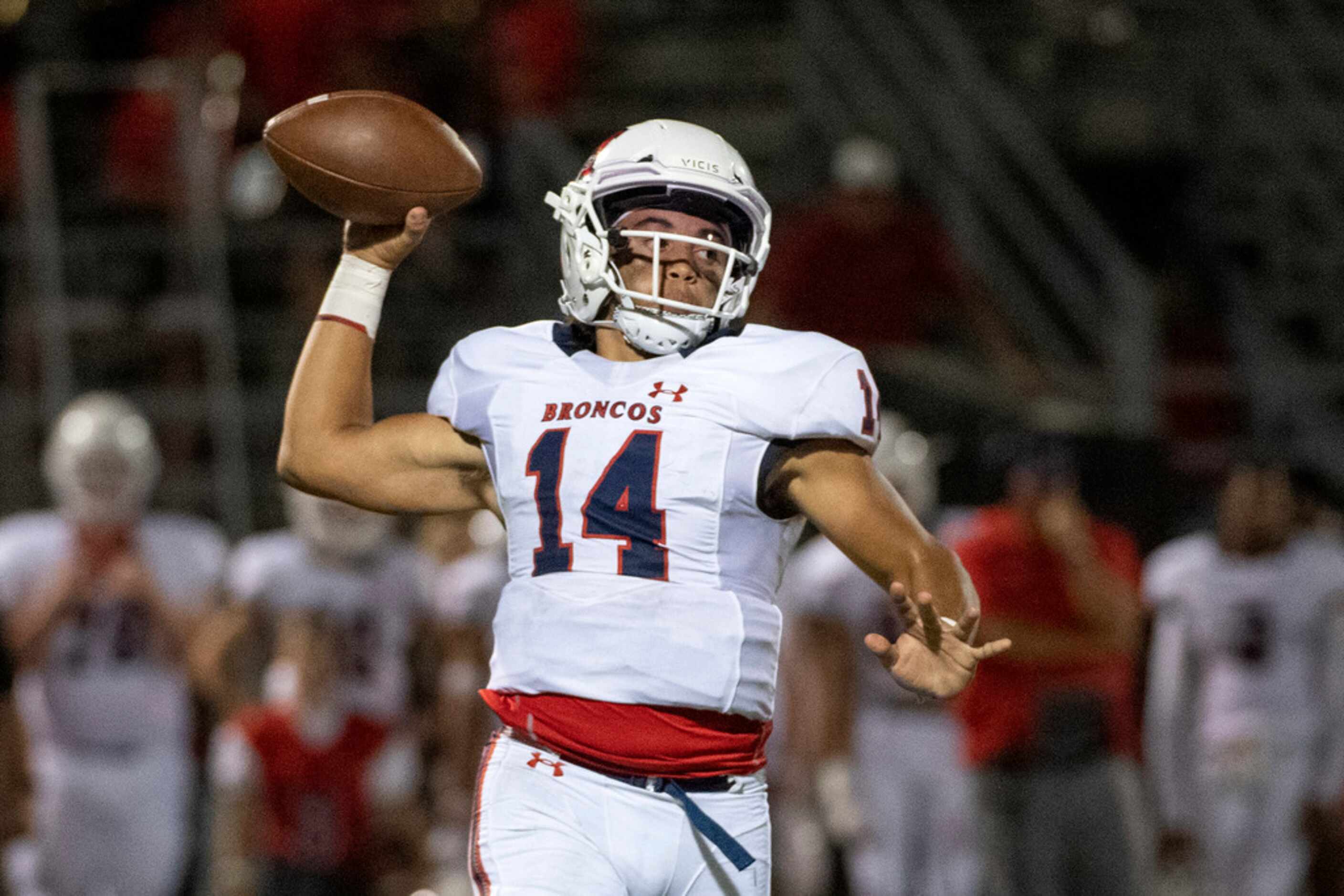 McKinney Boyd sophomore quarterback Carter Whitefield (14) winds up to throw in the second...