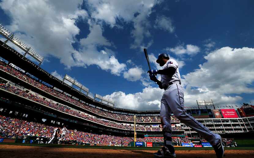Texas Rangers right fielder Nomar Mazara walks to the batter circle against the Houston...