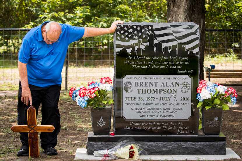 Sam Thompson visited the grave of his son, DART police Officer Brent Thompson, on June 25,...