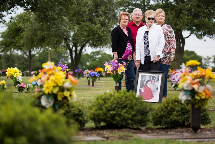  Members of Alan Nevil's family, from left, sister Fran Cawley, brother Ricky Nevil, Sr.,...