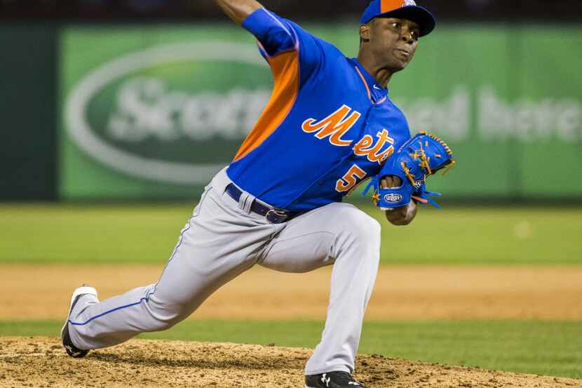 FILE - New York Mets starting pitcher Rafael Montero (50) pitches during their exhibition...
