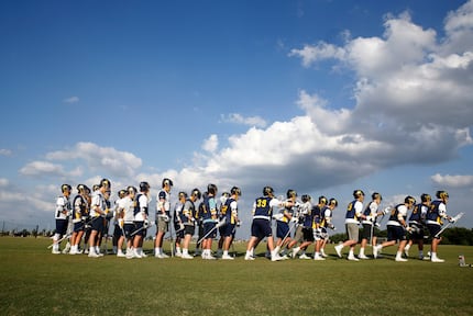 Highland Park lacrosse players take the field during practice at MoneyGram Park in Dallas on...
