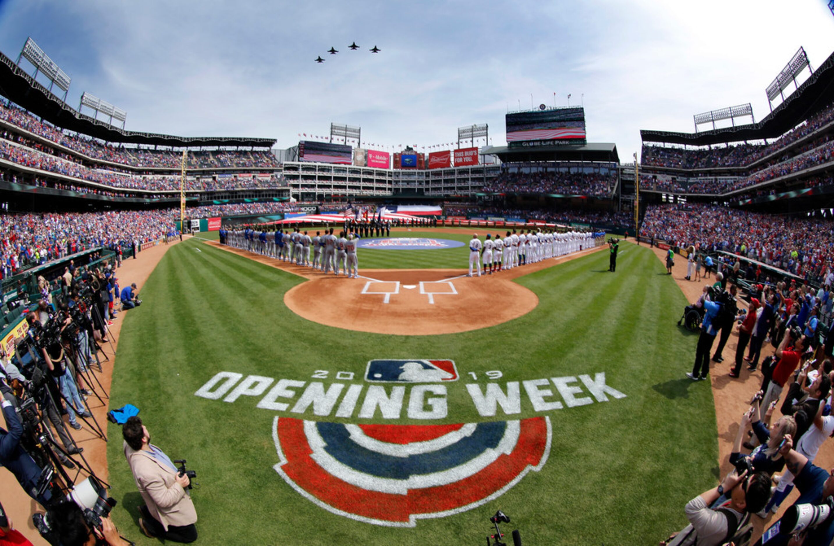 As seen with a fisheye lens, four F-16 jet fighters perform the flyover following the...