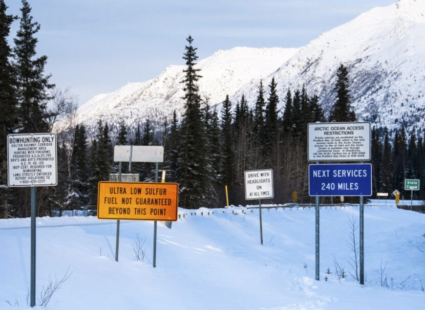 Signs warn of what lies ahead.  Beyond Coldfoot, there is no food, fuel or public flush...