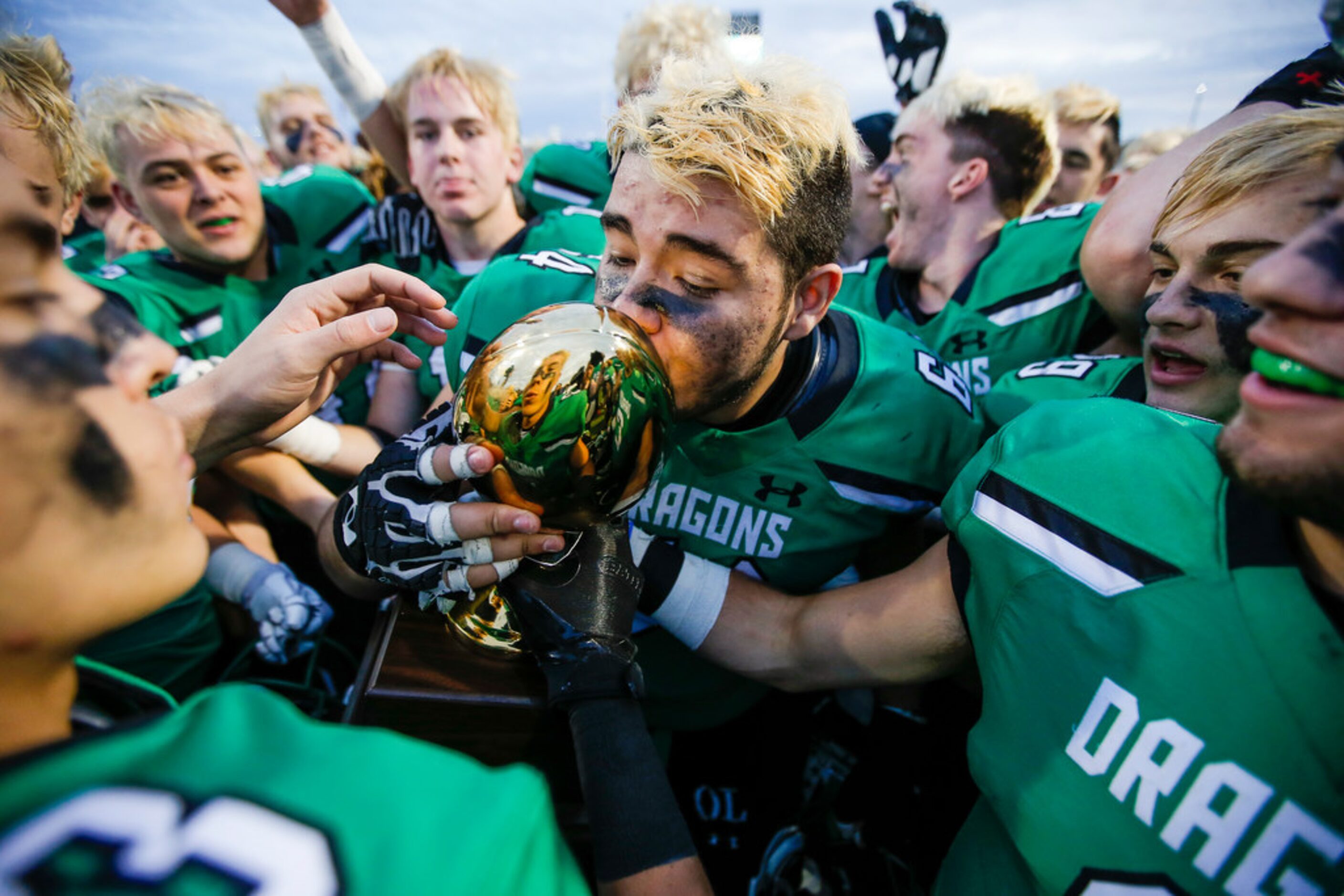 TXHSFB Southlake Carroll junior offensive lineman Brandon Borrasso (64) kisses the Class 6A...