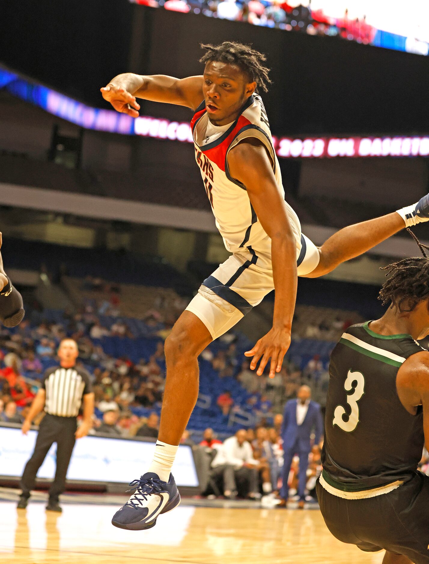 Dallas Kimball Barack Holland (11) scores over Killeen Ellison Ademola Oladipo (3). Dallas...