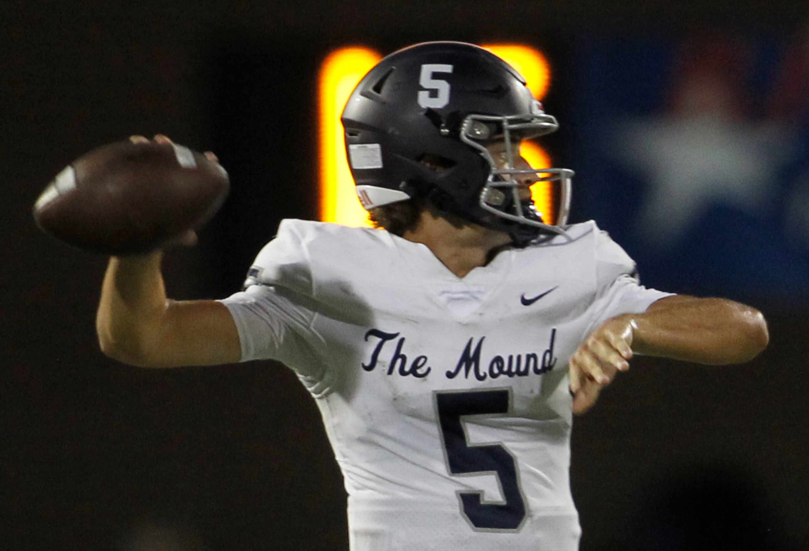 Flower Mound quarterback Jake Watson (5) launches a pass downfield during second quarter...