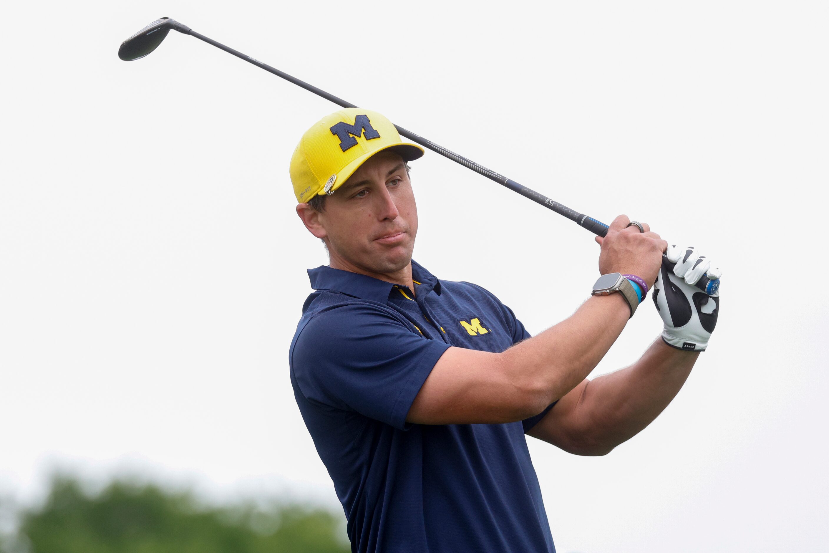 Former Texas Rangers pitcher Derek Holland tees off from the first hole during the first...