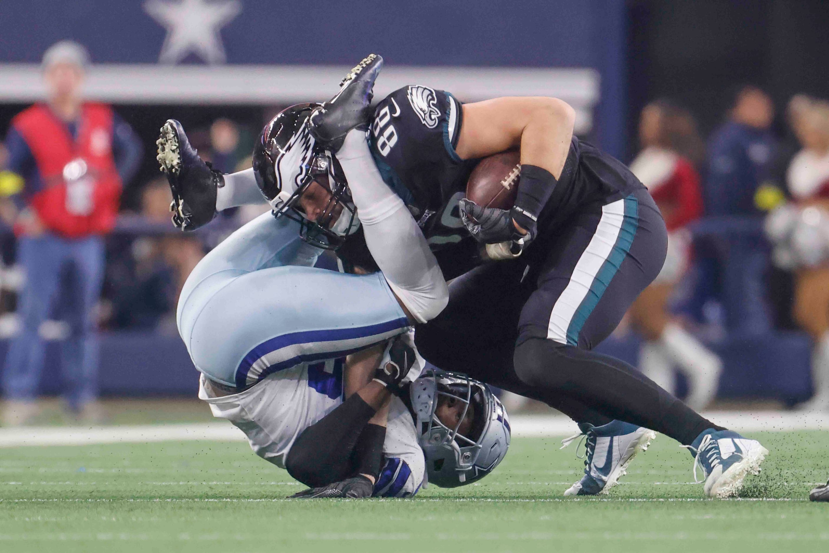 Philadelphia Eagles tight end Dallas Goedert (88), right, gets locked by Dallas Cowboys...