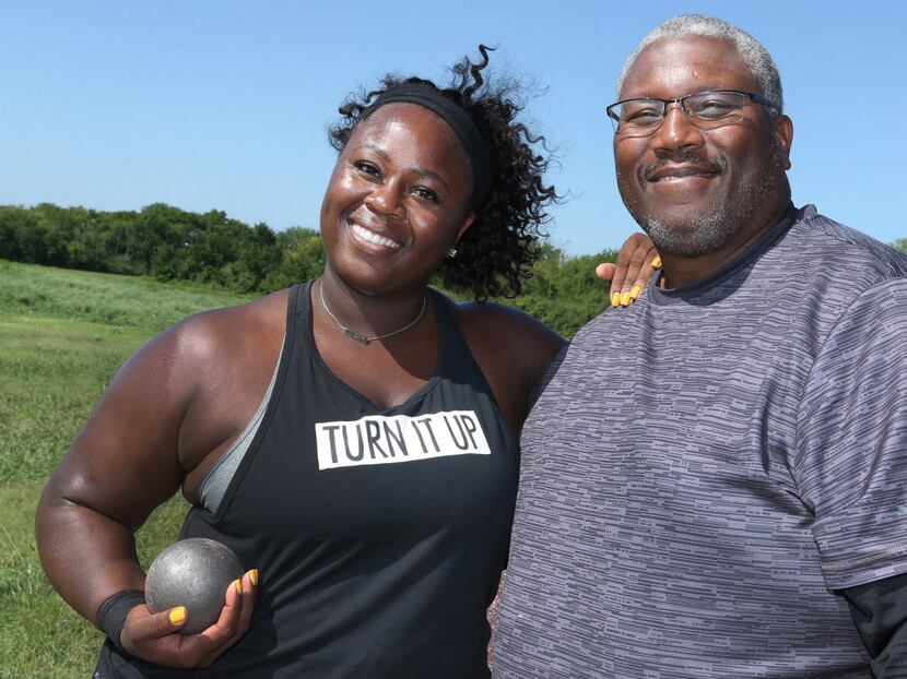Olympian Michelle Carter is pictured with her father Michael Carter at the Jesse Owens...