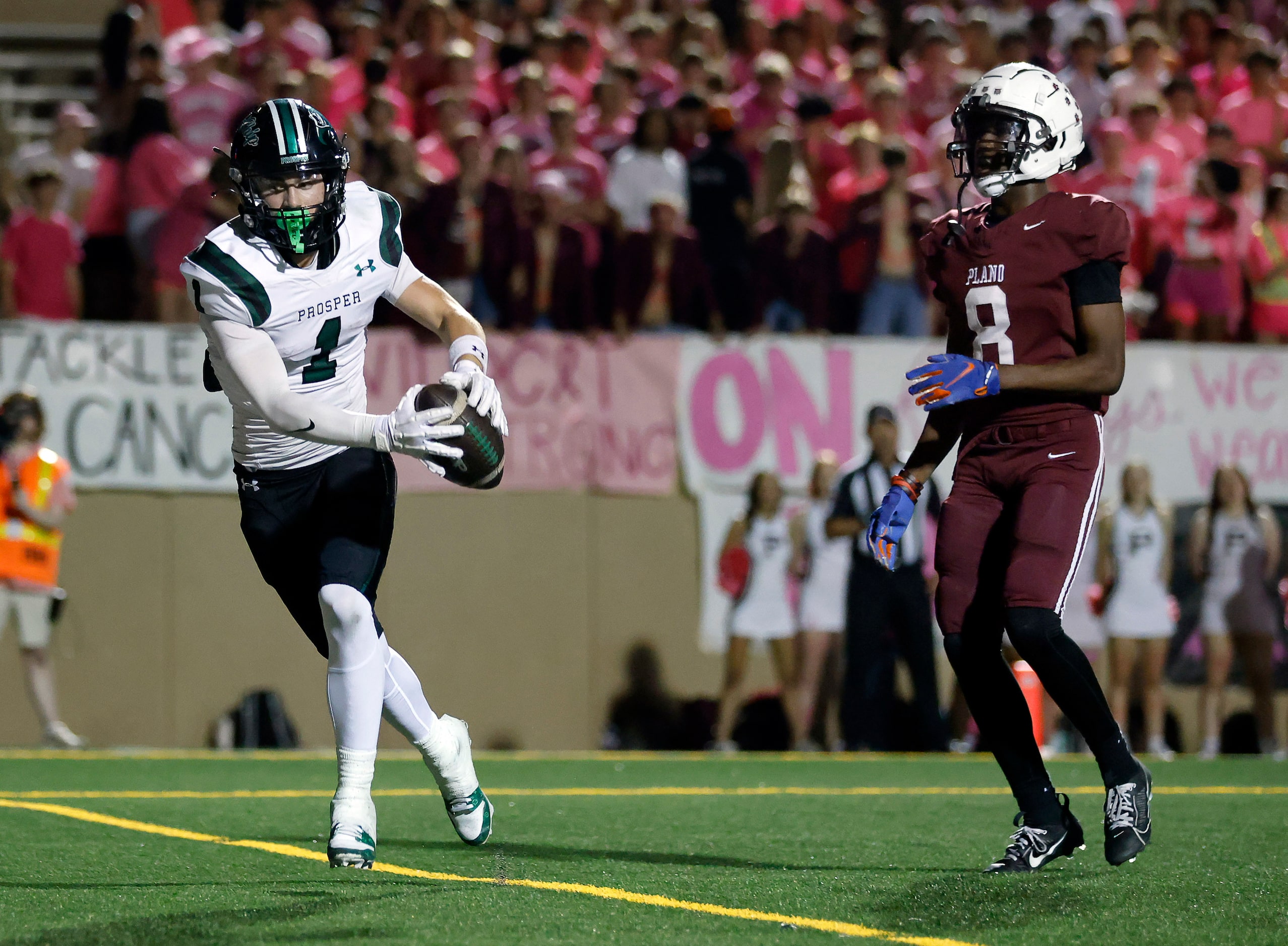 Prosper High wide receiver Leo Anguiano (1) catches a first half touchdown in the back of...