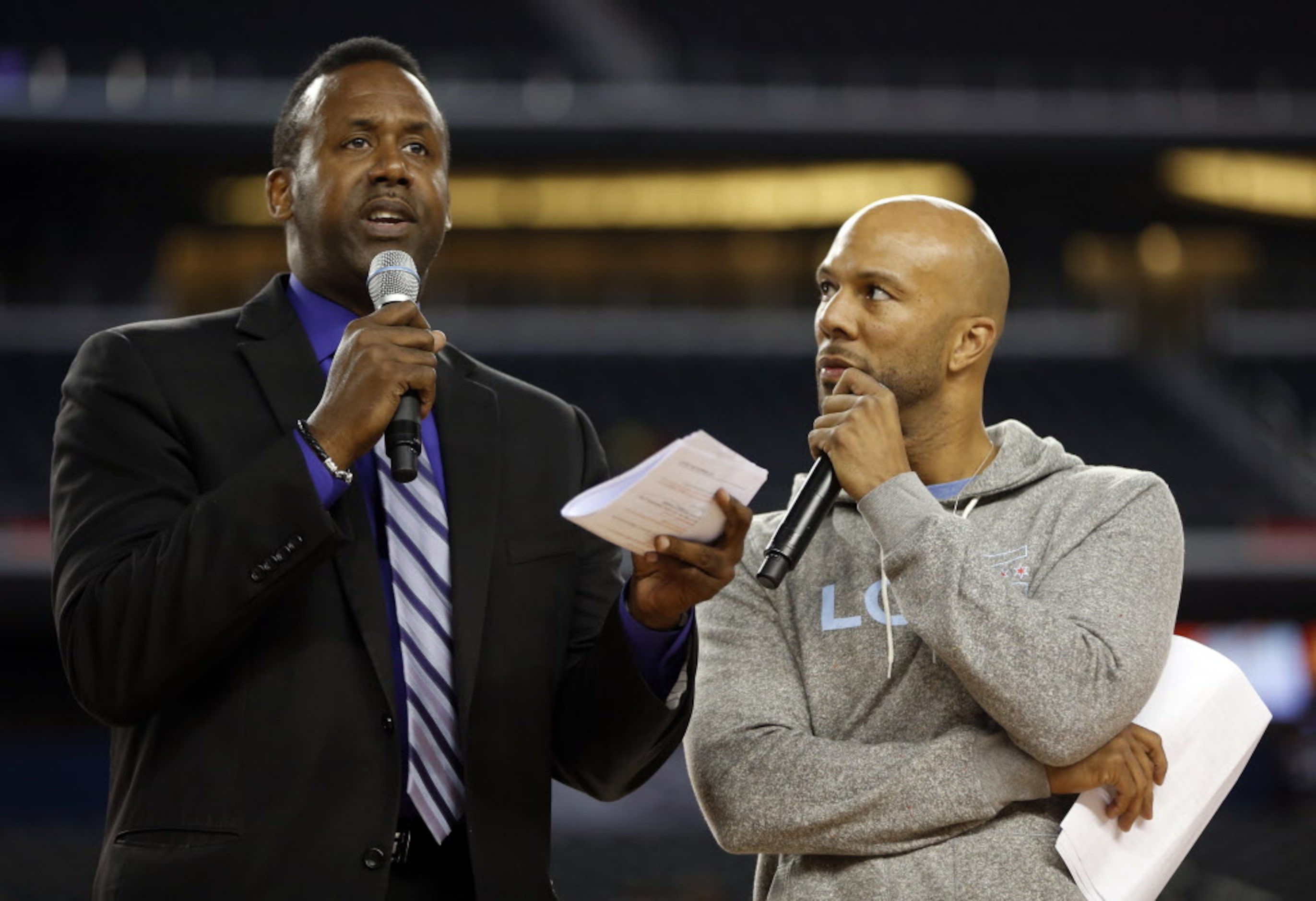 Former Dallas Mavericks player Rolando Blackmon speaks as Common listens during the Reese's...