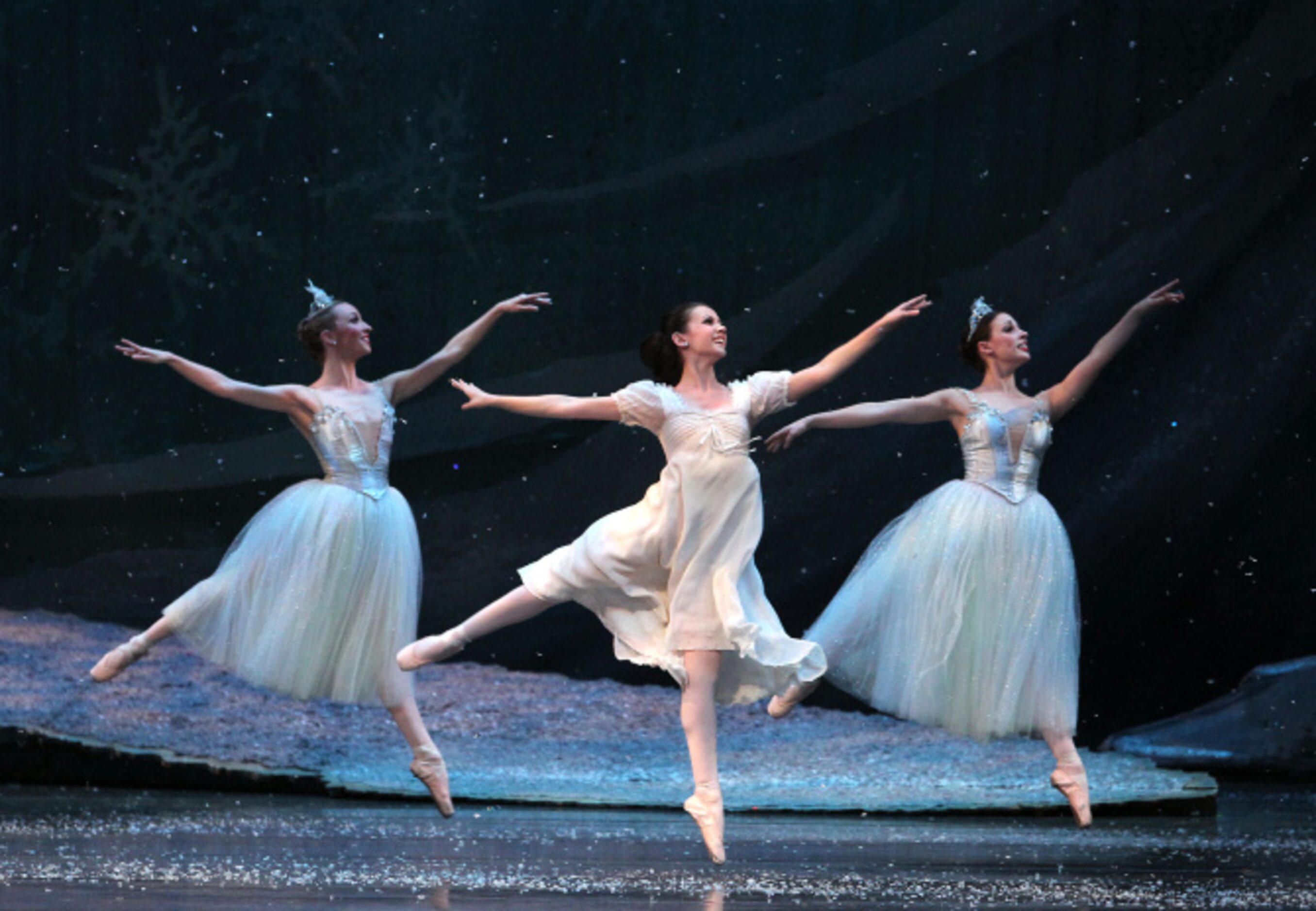 Clara played by Alexandra Farber dances with Snowflakes in Texas Ballet Theater's "The...