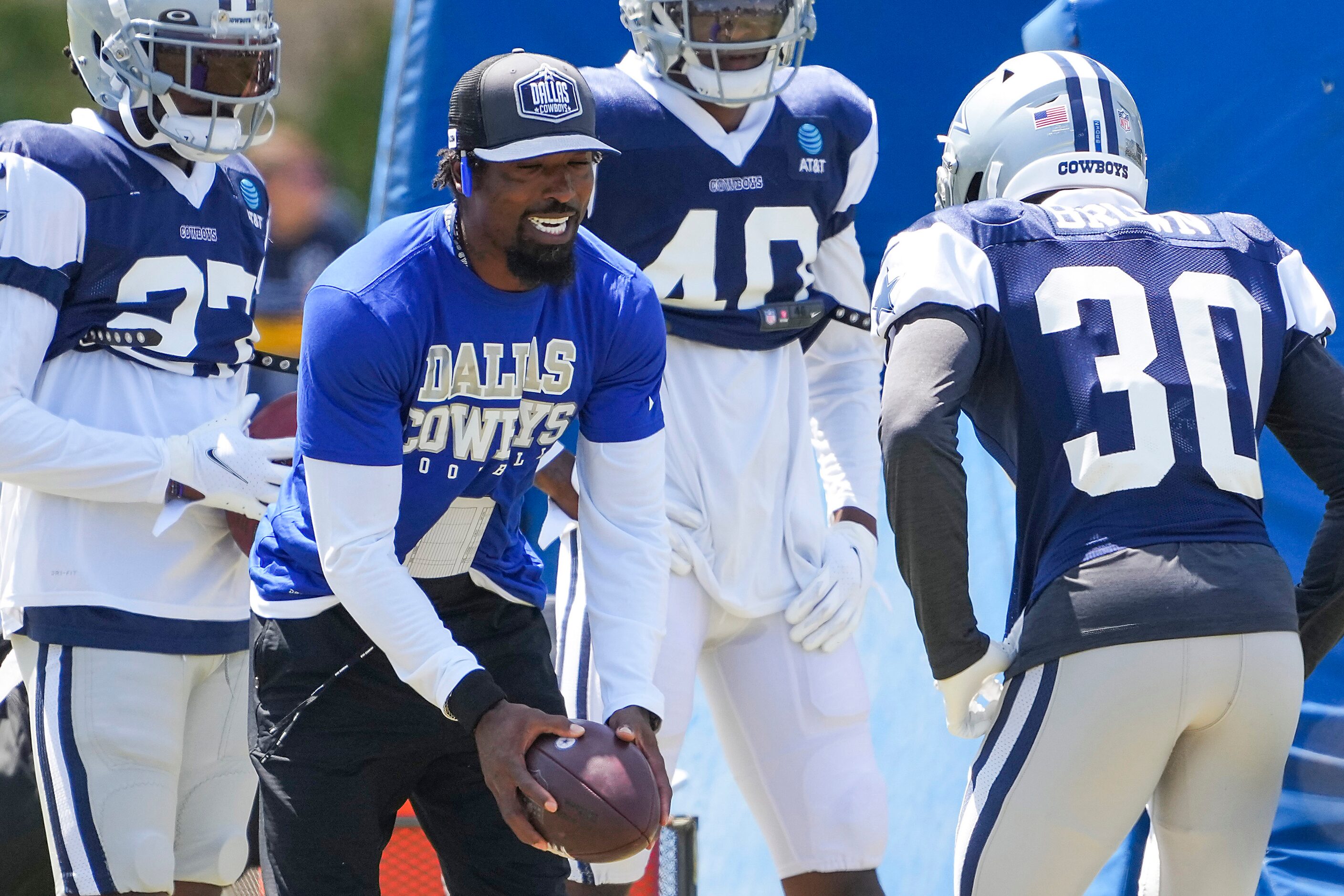 Dallas Cowboys defensive backs coach Al Harris works with cornerback Anthony Brown (30)...