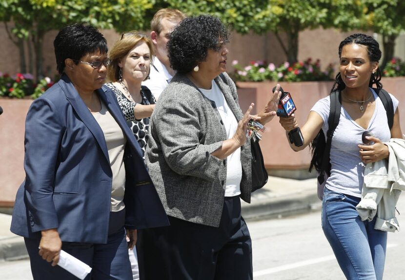 Kathy Nealy (left) leaves the federal courthouse in July 2014 after being indicted on...