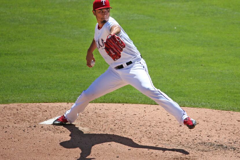 Texas Rangers starting pitcher Yu Darvish (11) throws a third-inning pitch during the Kansas...