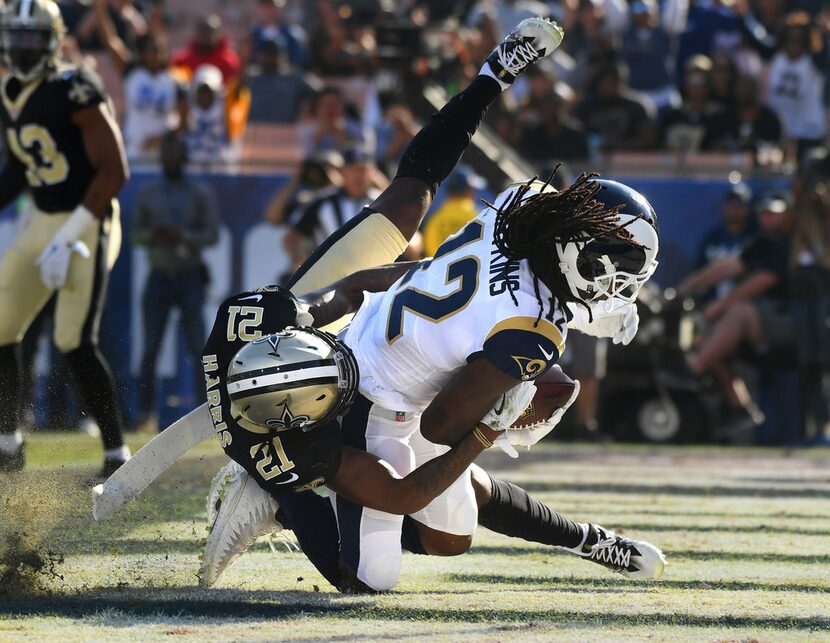 FILE - Los Angeles Rams receiver Sammy Watkins catches a touchdown pass as he is being...